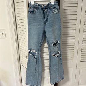 Stradivarius flare, ripped, blue jeans. USA 4; EUR 36.
